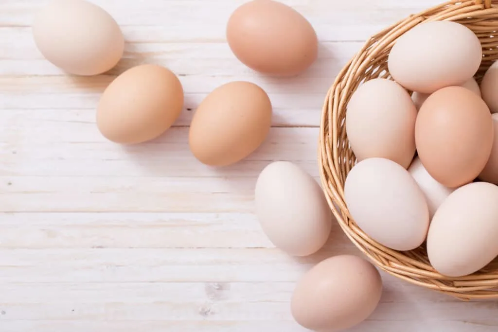 eggs on white wooden background